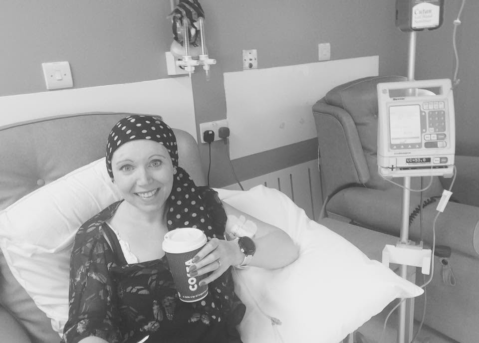 Karma having chemo treatment, holding a coffee cup